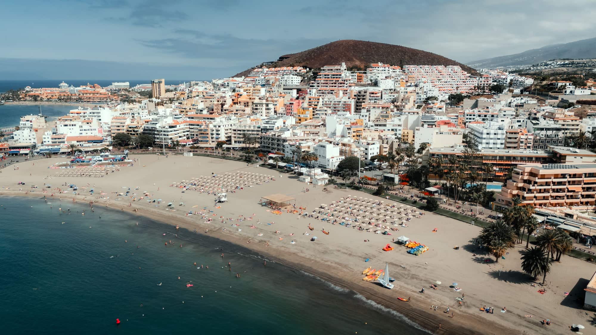 Los Cristianos beach and town with Montana Chayofita rising behind it