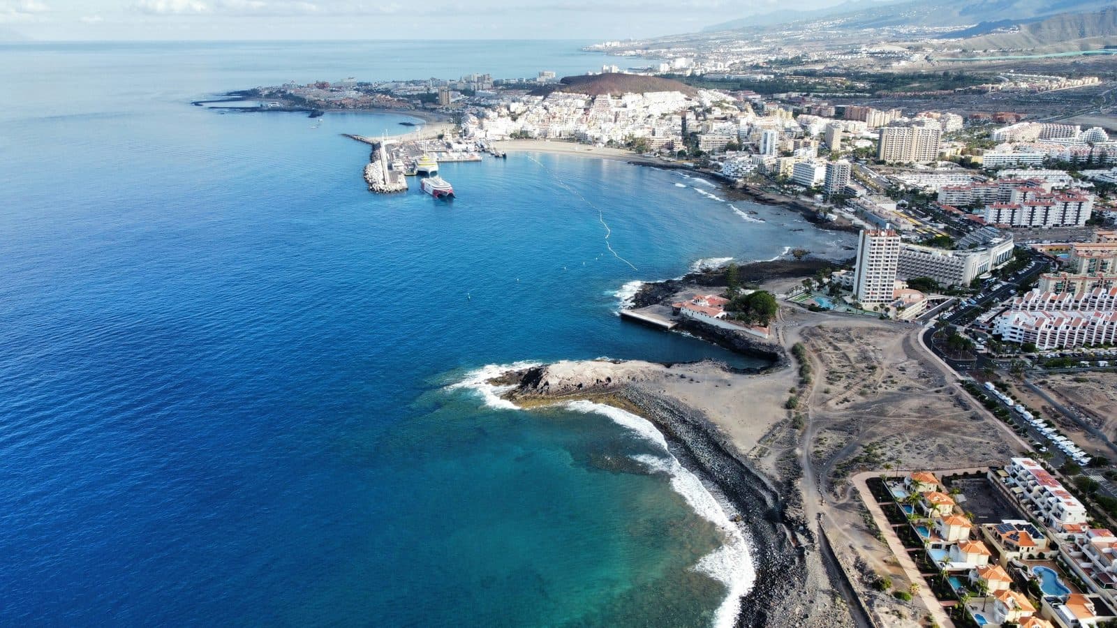 Los Cristianos from the air, the ferry harbour and the beach along the town