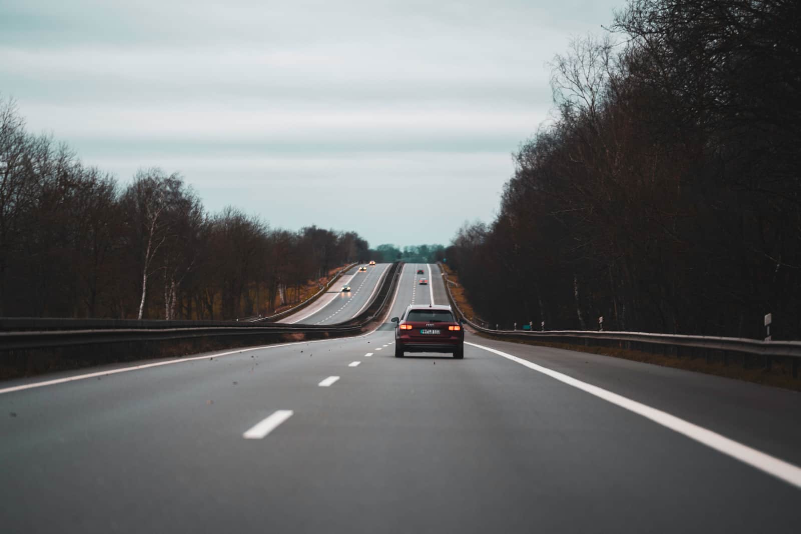 Traffic on a Tenerife motorway running between wooded hills