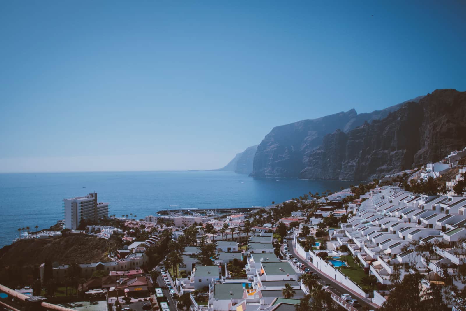The town of Los Gigantes built on the slope beside its harbour