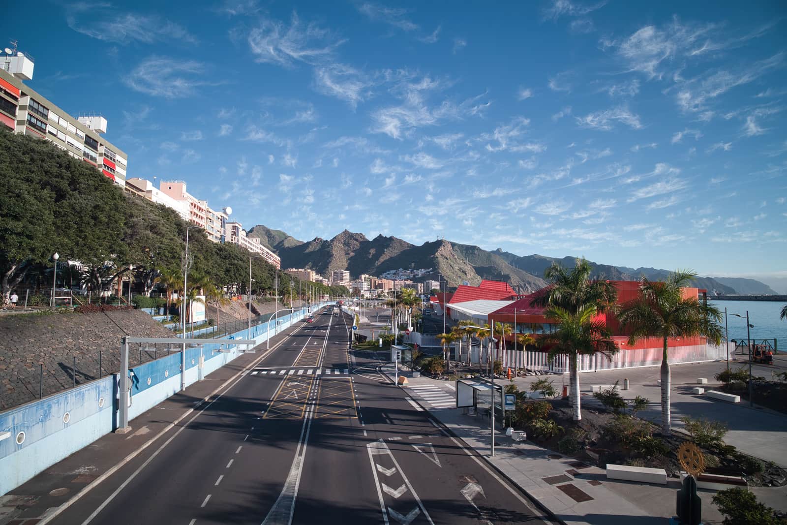 A coastal road running out of Santa Cruz below the hills
