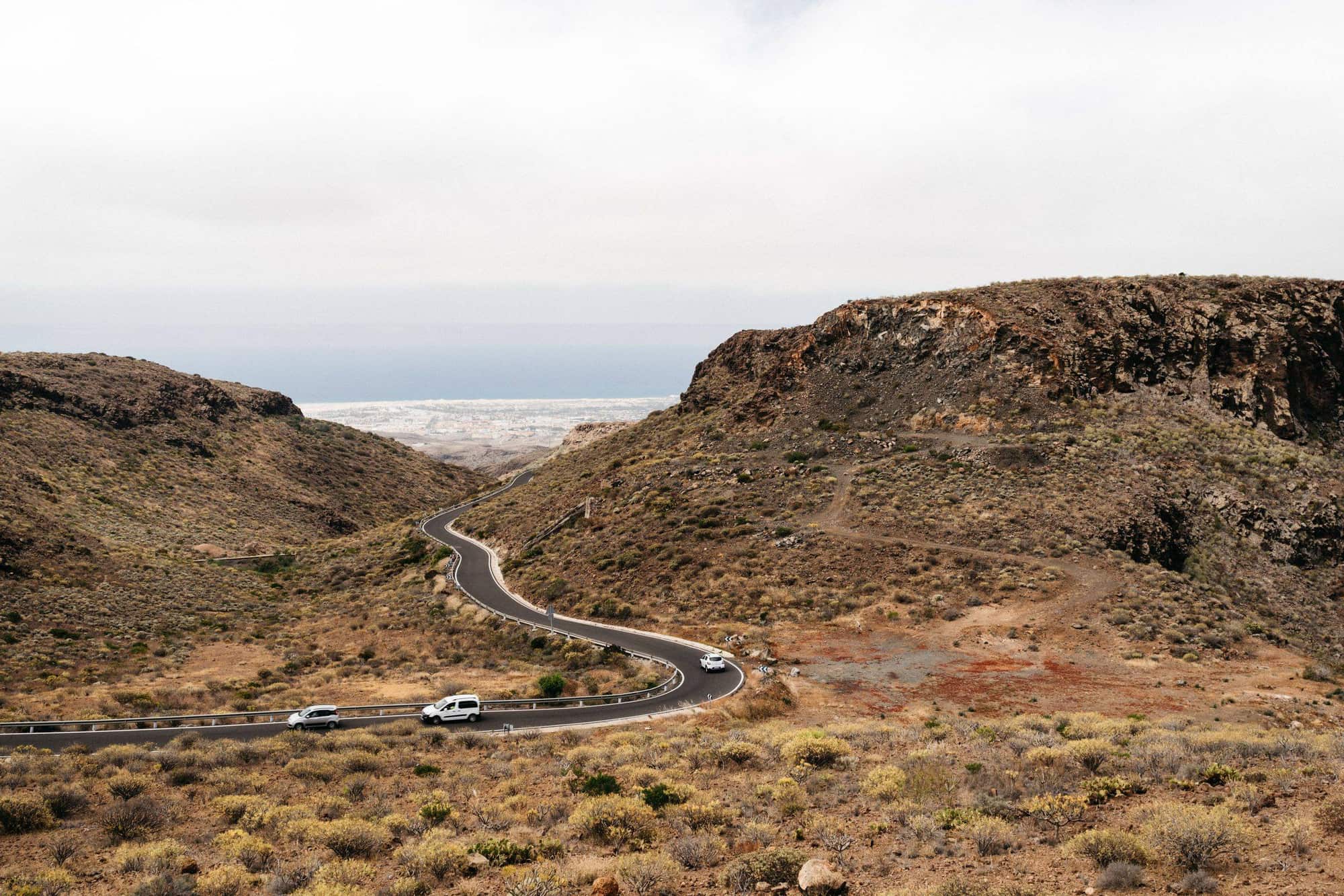 The road down through the dry hills of southern Tenerife towards the coast